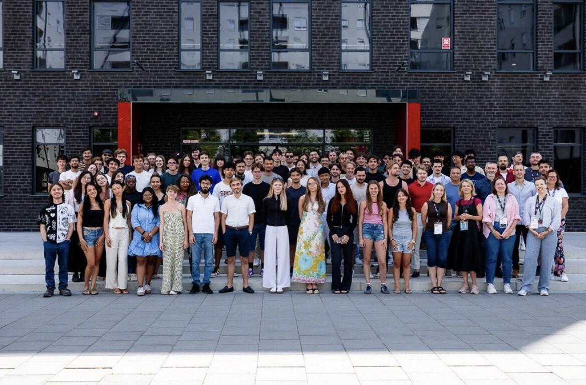Cybersecurity Summer School participants gathered outside the university